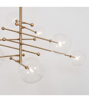 The chandelier Celeres, a light and airy design thanks to the association of brass and blown glass