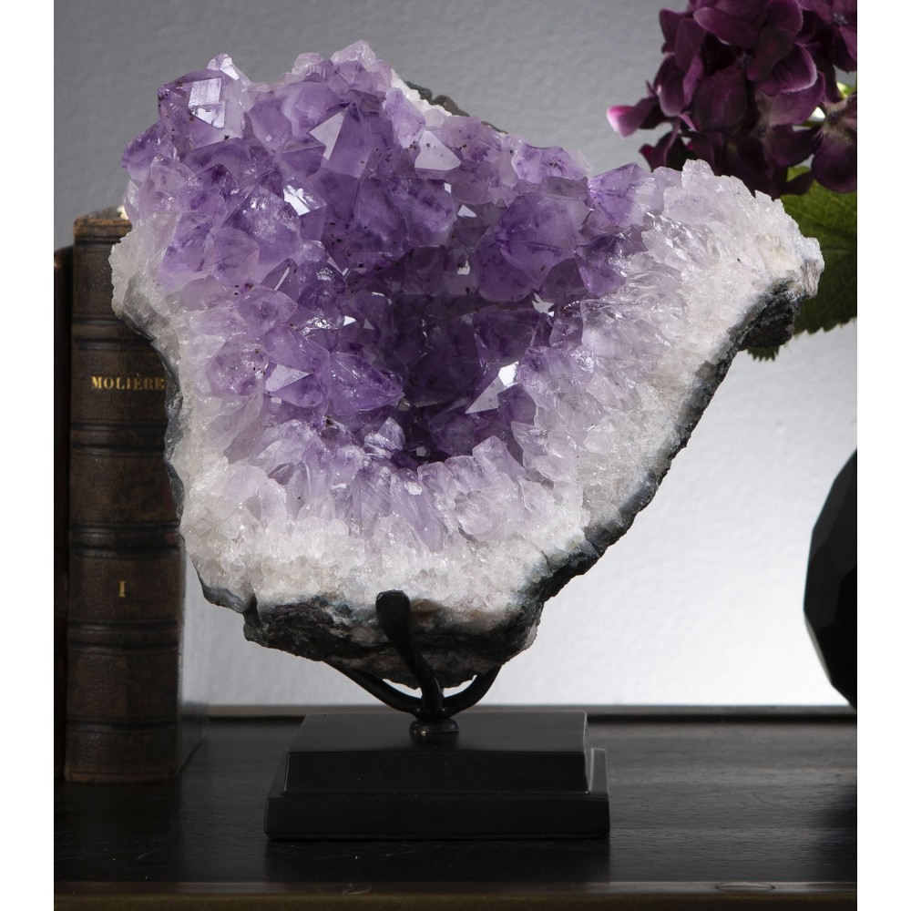 Magnificent amethyst in an agate geode from Uruguay on its wooden